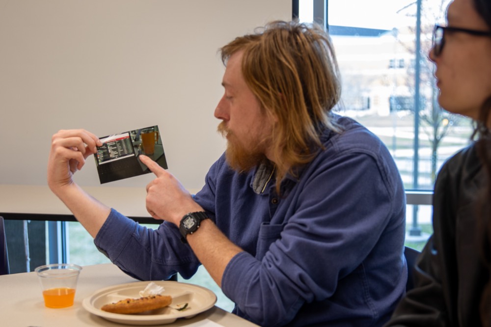 Boy displaying one of his photos